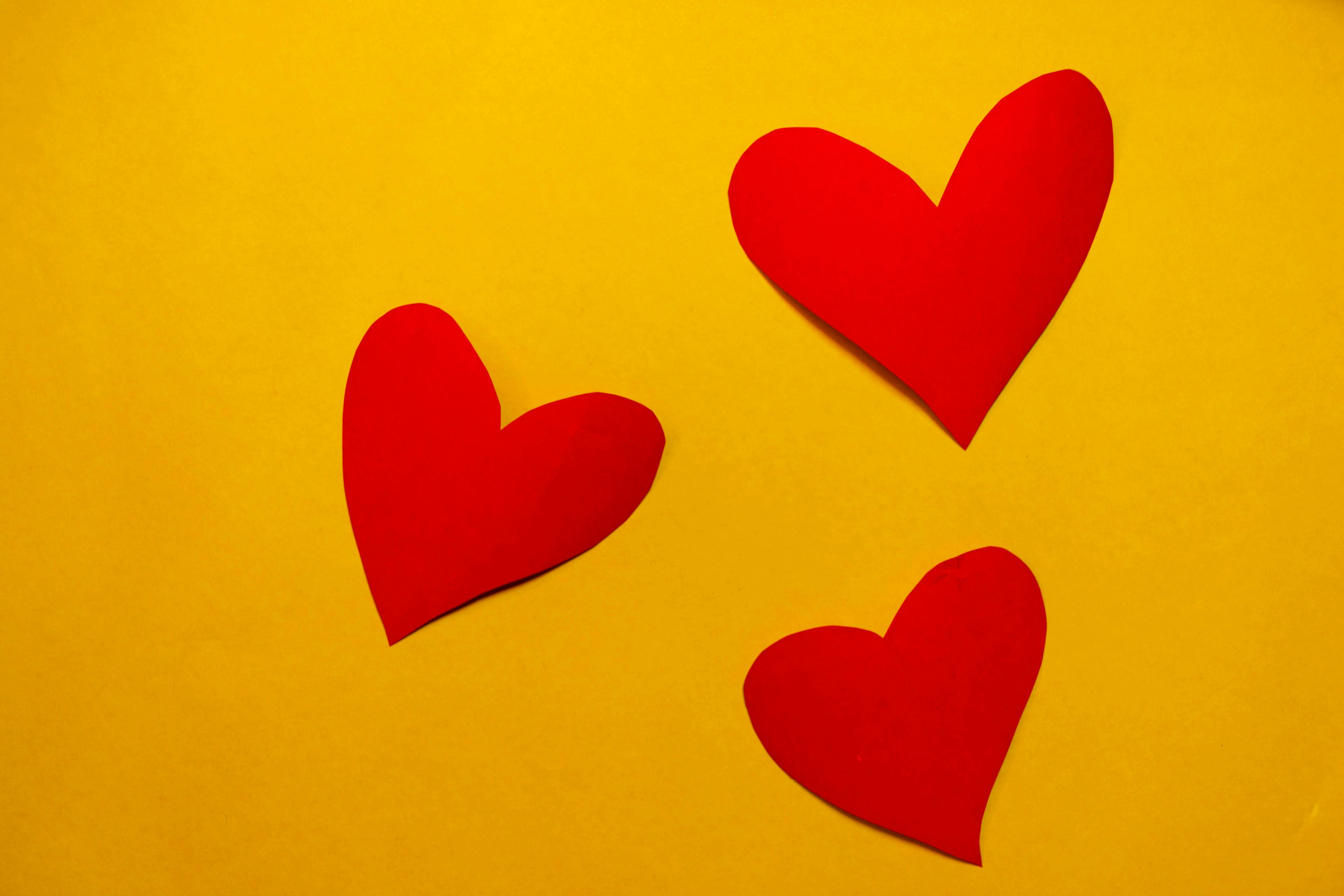 Red hearts on a yellow background